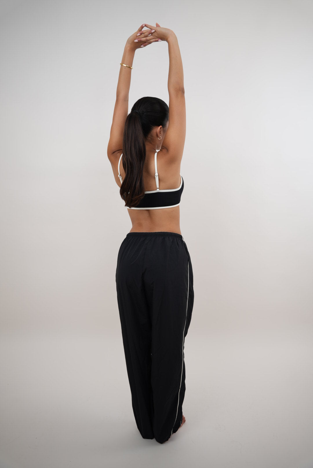 Black relaxed fit pant by KIMITH BRAND with "I Accept Change with Grace" print, versatile and comfortable for everyday wear.