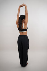 Black relaxed fit pant by KIMITH BRAND with "I Accept Change with Grace" print, versatile and comfortable for everyday wear.