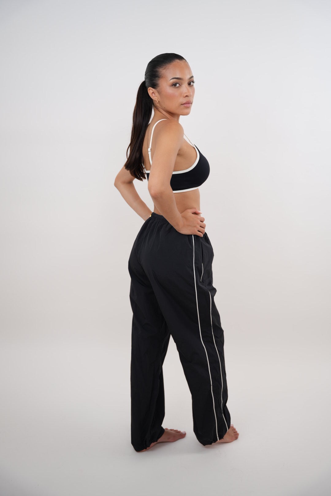Black relaxed fit pant by KIMITH BRAND, versatile and comfortable with an "I Accept Change with Grace" design.