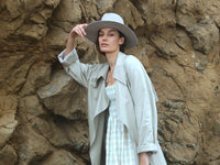 Urban Collection by KIN THE LABEL featuring a stylish model wearing contemporary streetwear in a city setting.