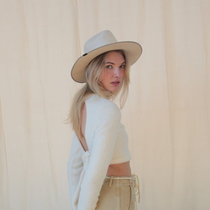 Wool hat from KIN THE LABEL Modern Collection featuring a stiffened, structured design in neutral tones.