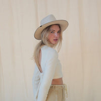 Wool hat from KIN THE LABEL Modern Collection featuring a stiffened, structured design in neutral tones.