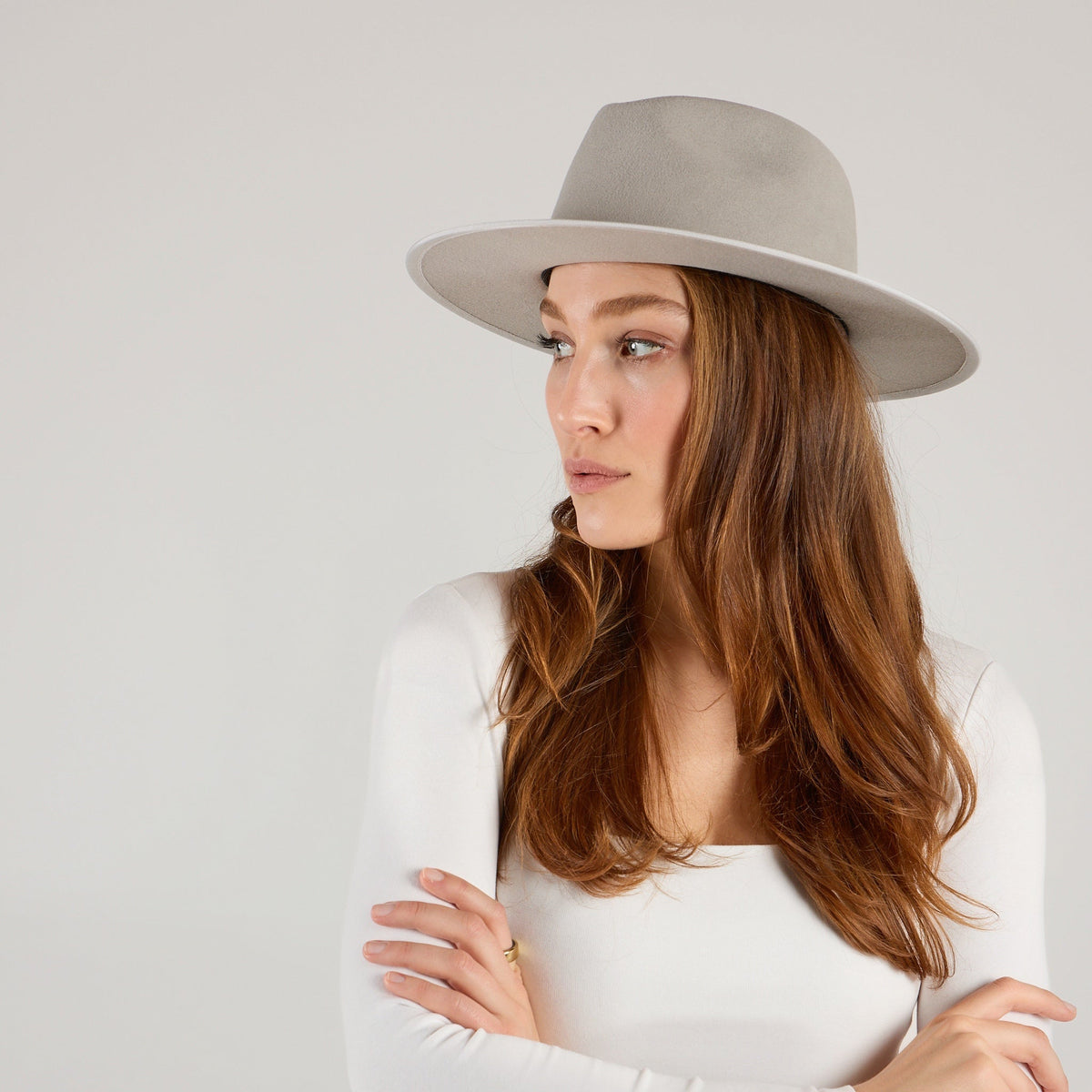 Packable wool camisole from KIN THE LABEL's Essentials Collection, featuring a soft, lightweight design and neutral color.