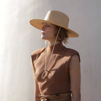 Ivory small sun hat from KIN THE LABEL's collection, featuring a wide brim and lightweight design for sun protection.