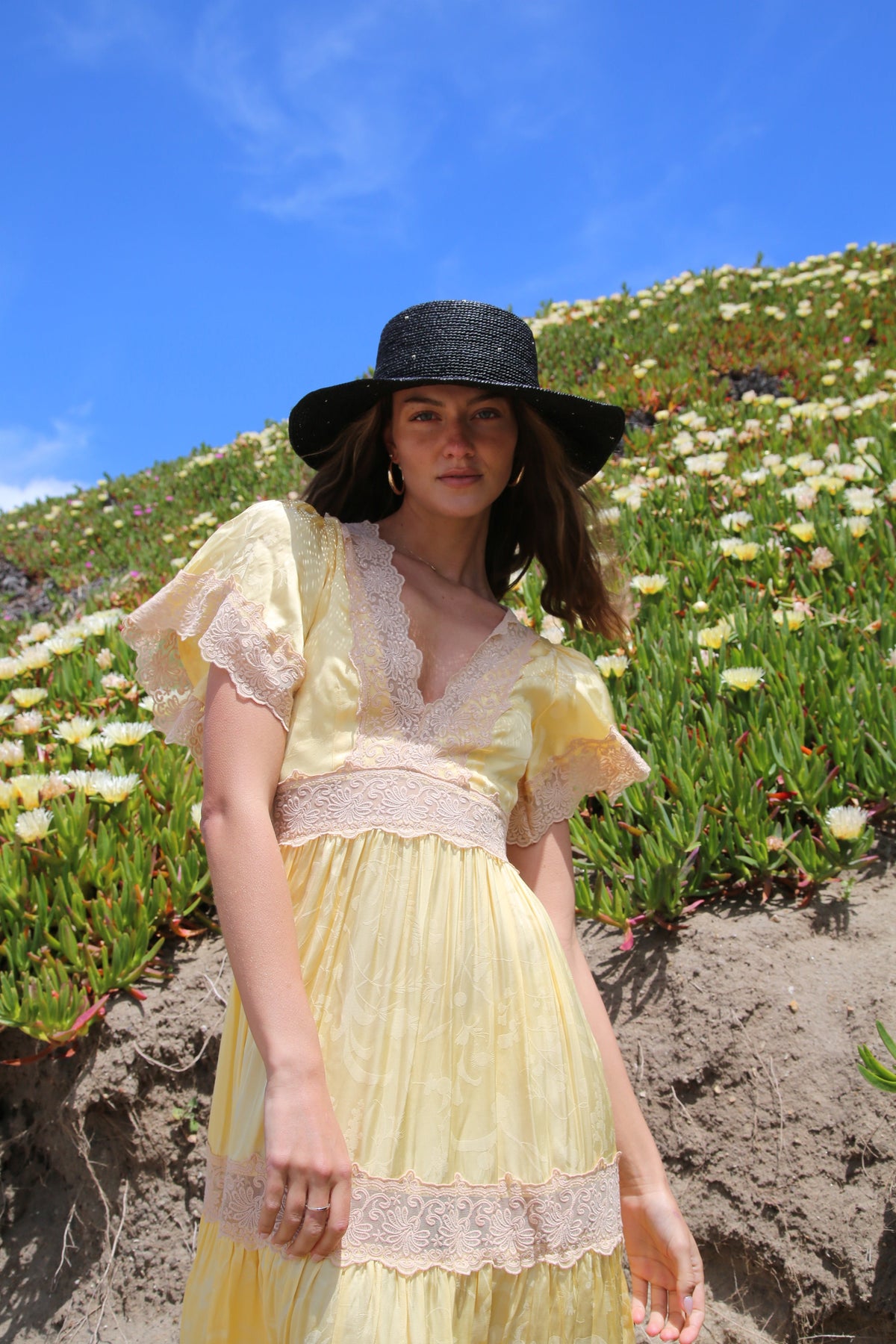 Kin the Label Resort Collection straw hat featuring a wide brim and raffia material, perfect for sunny outdoor occasions.