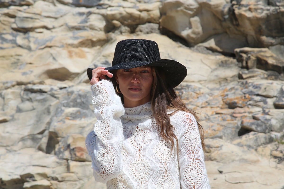 Kin the Label Resort Collection straw hat with wide brim and raffia weave, perfect for sun protection and stylish beachwear.