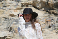 Kin the Label Resort Collection straw hat with wide brim and raffia weave, perfect for sun protection and stylish beachwear.