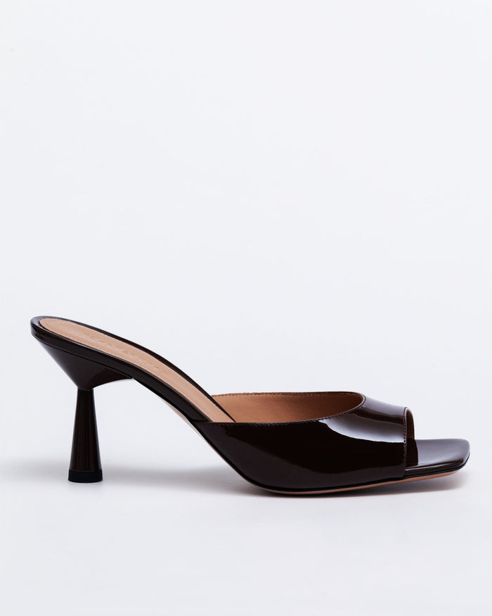 Chocolate brown Kolane Greta Mule Heels made of leather, featuring a sleek mule design with a comfortable heel height.