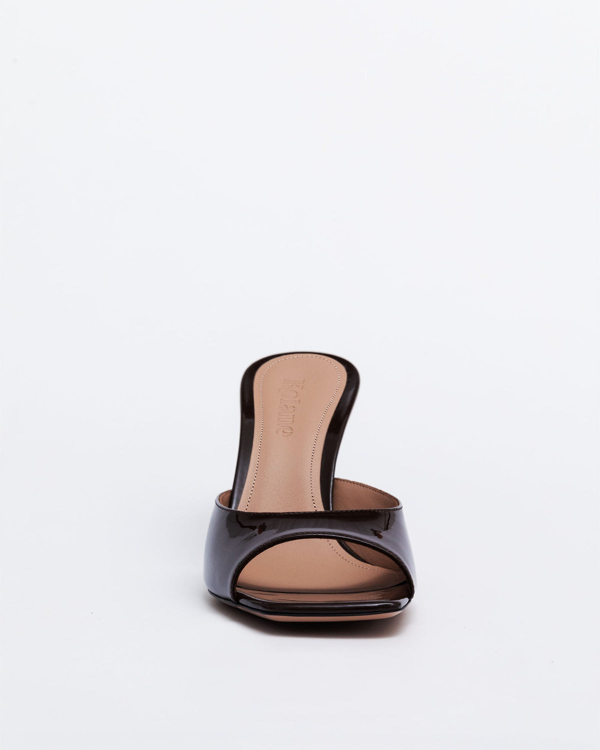 Chocolate brown leather Greta Mule Heels by Kolane, showcasing stylish slip-on mule design with a comfortable heel.