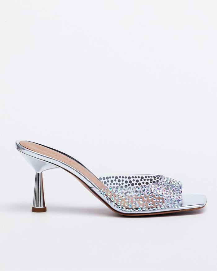 Silver Kolane Greta Mule slippers with crystal embellishments, slip-on mule style with a sleek design and decorative crystals.
