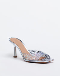 Silver Kolane Greta Mule slippers with crystal embellishments, slip-on mule design featuring elegant detailing.