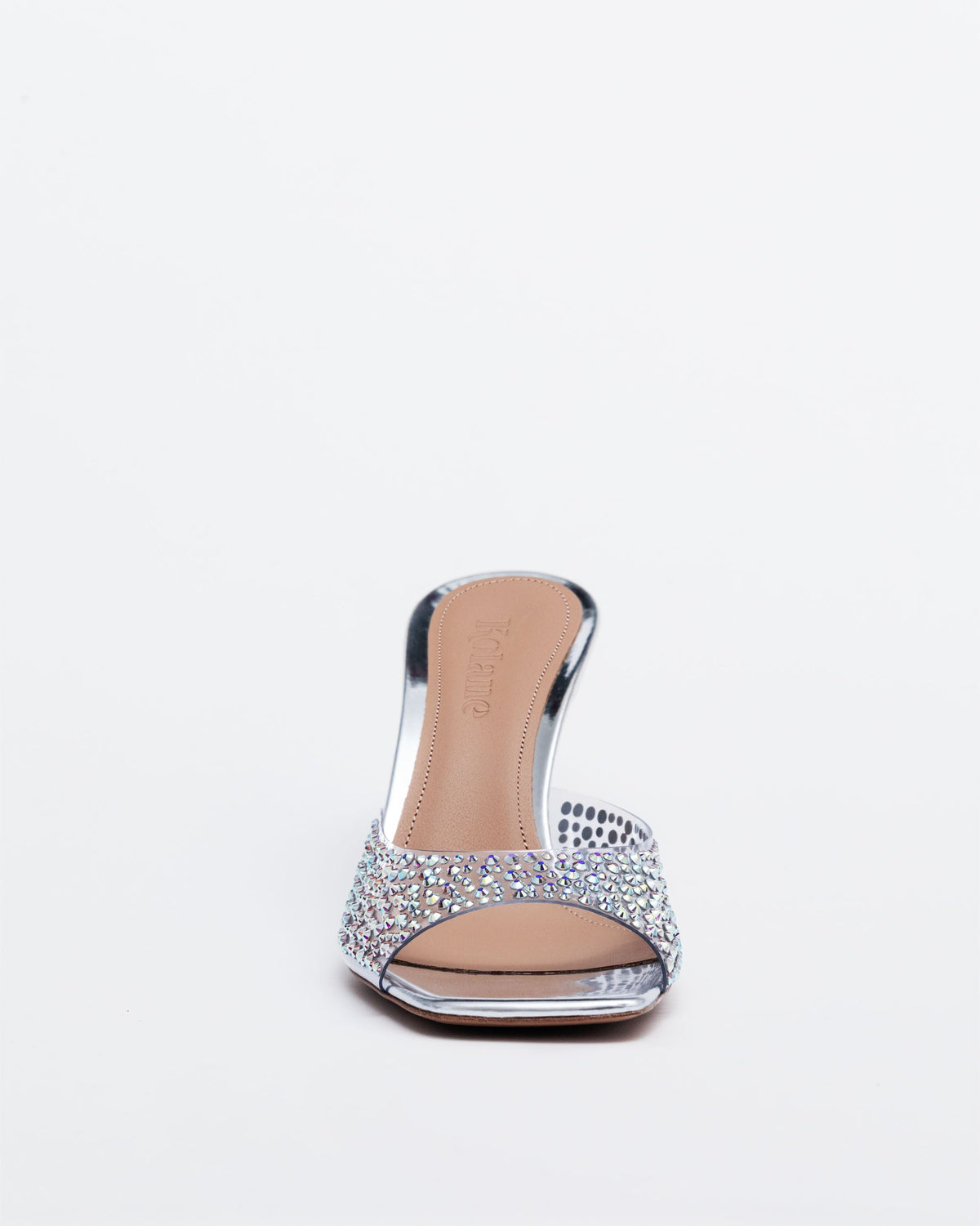 Silver Kolane Greta Mule slippers with crystal embellishments, showcasing elegant slip-on mule design and decorative sparkle detail.