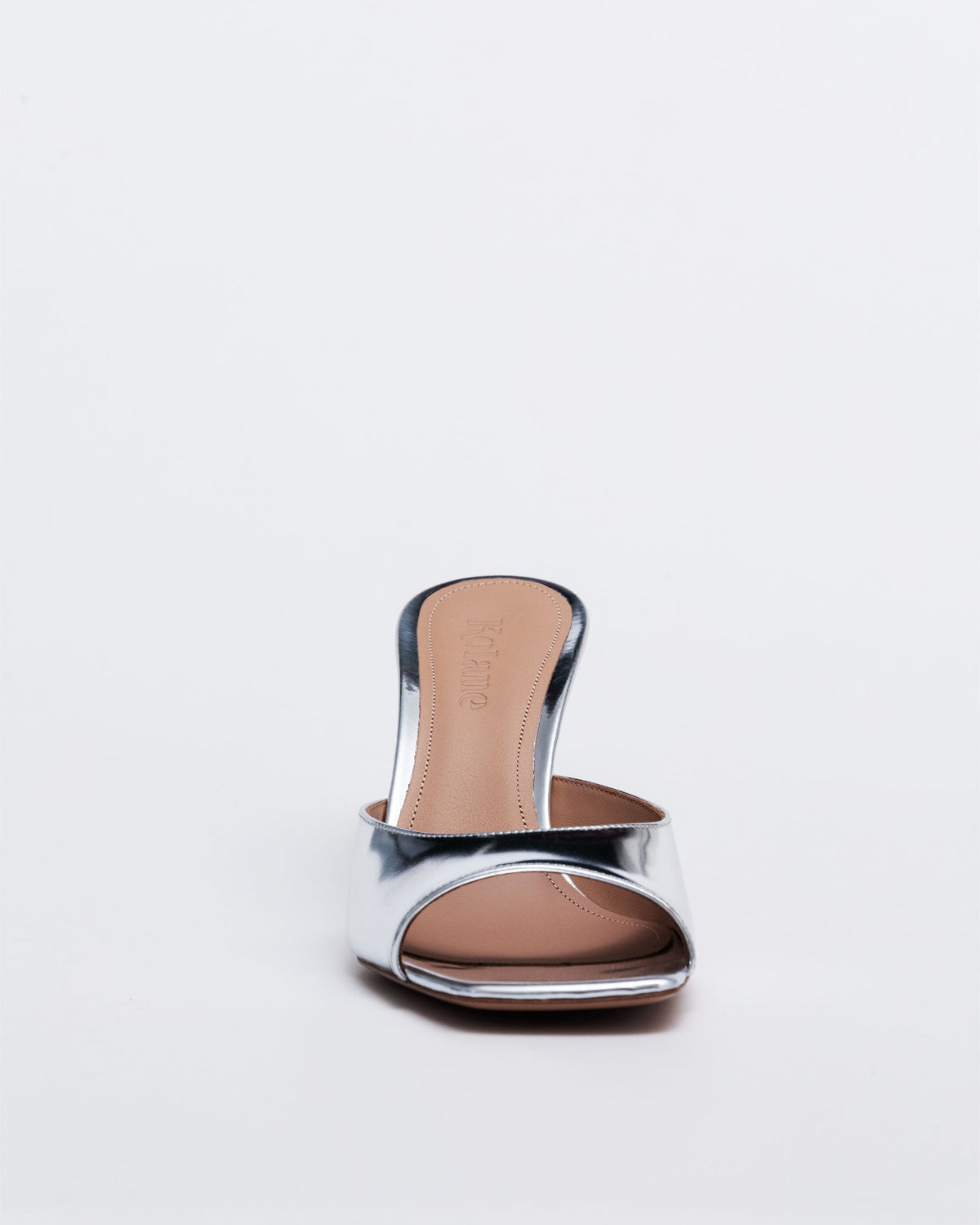 Kolane Greta Mule in silver mirror leather, low high heel design, stylish slip-on footwear with sleek leather finish.