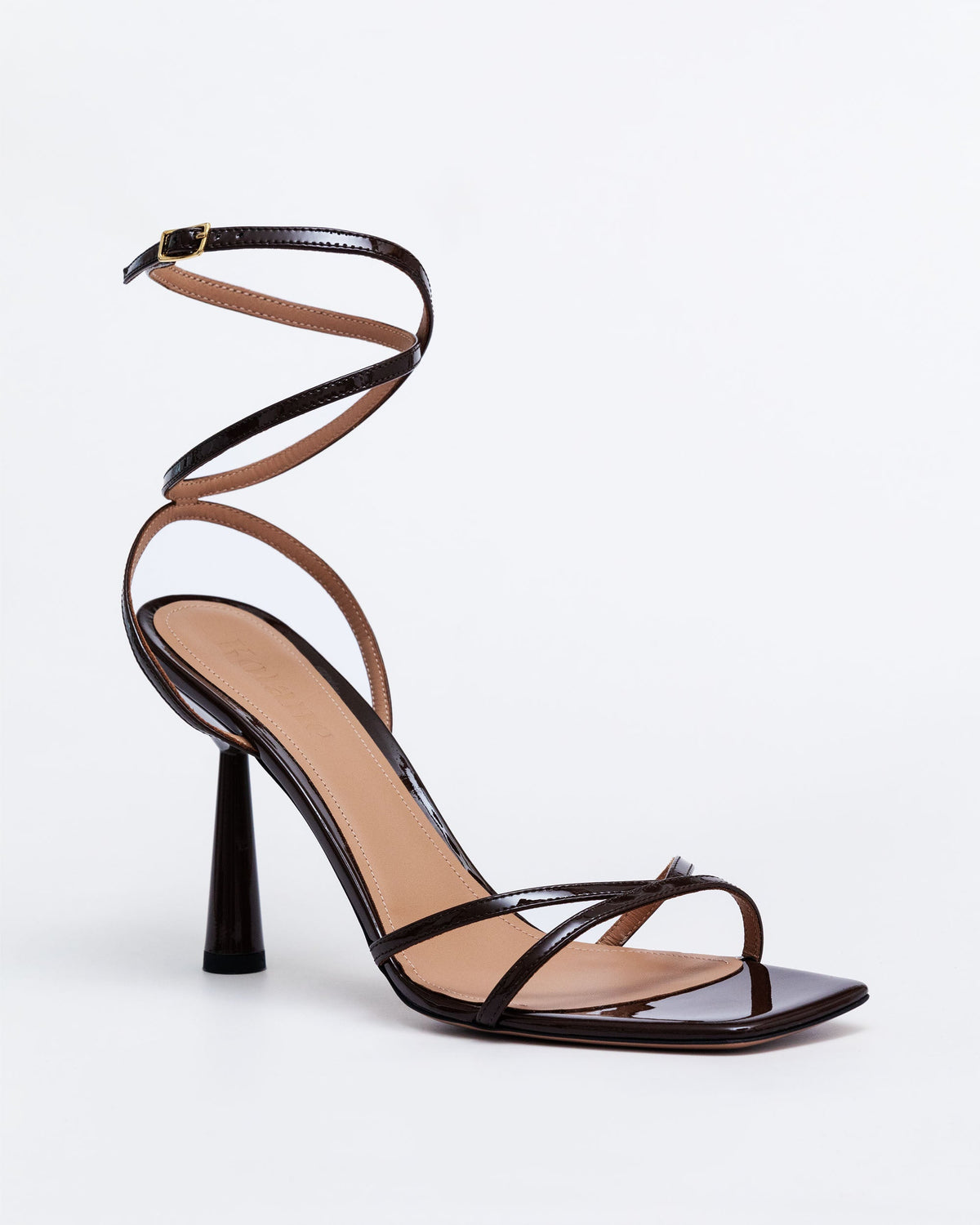 Chocolate brown Isabel Nicaraua sandals by Kolane featuring sleek leather straps and comfortable flat sole.