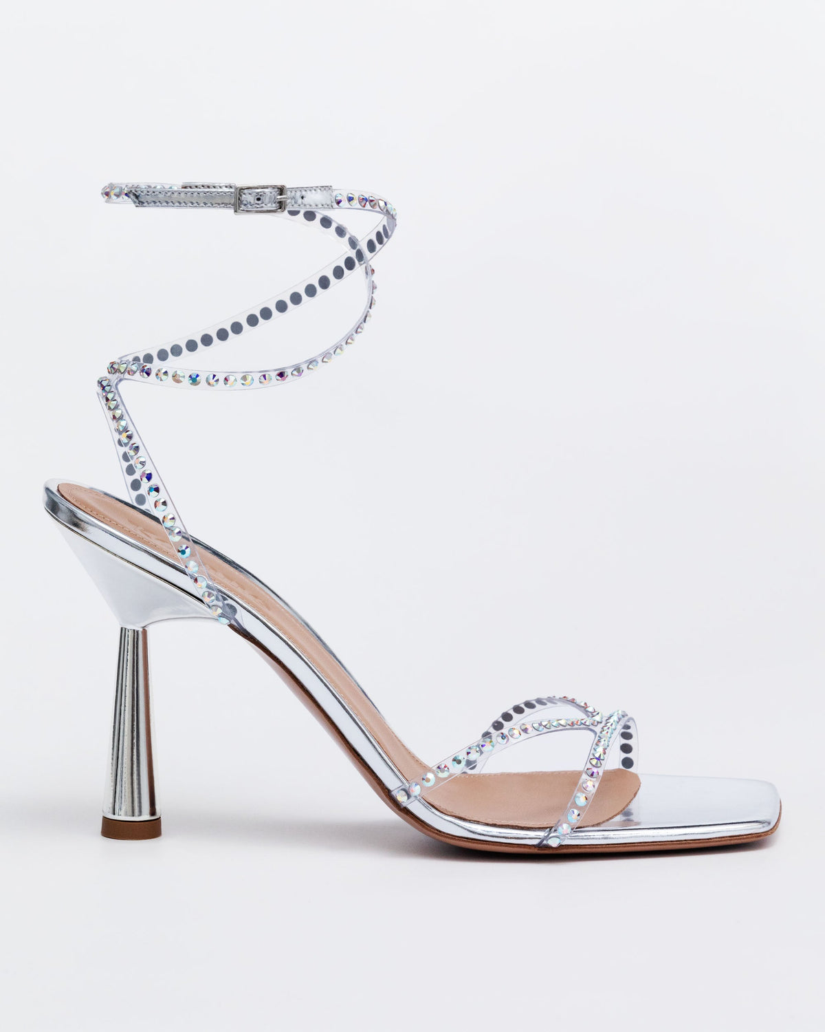 Silver Kolane High Kim Sandal with crystal embellishments, showcasing elegant straps and sparkling details on a stylish footwear design.