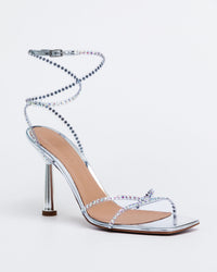 Silver Kolane High Kim Sandal with crystal embellishments, showcasing elegant open-toe design and stylish straps.