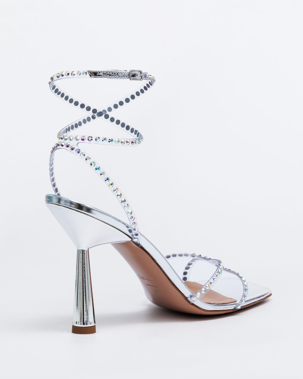 Silver Kolane High Kim Sandal with crystal embellishments, showcasing elegant strappy design and sparkling details.