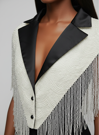 L'Jai Amor CEO Energy Cape in vibrant fabric, showcasing its flowing design and bold colors for energetic style.