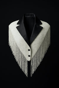 L'Jai Amor CEO Energy Cape draped over a mannequin showcasing its vibrant, flowing fabric and stylish design.