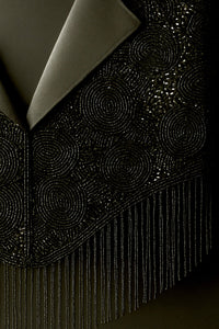 Close-up of The Exec by L'Jai Amor, a stylish men's watch with a sleek black dial and silver stainless steel band.