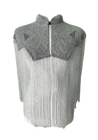 L'Jai Amor Argent Line Cape displayed on a hanger, showcasing its elegant silver fabric and flowing design.