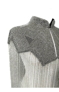 L'Jai Amor Argent Line cape draped over a mannequin, showcasing elegant design and lightweight fabric for stylish layering.