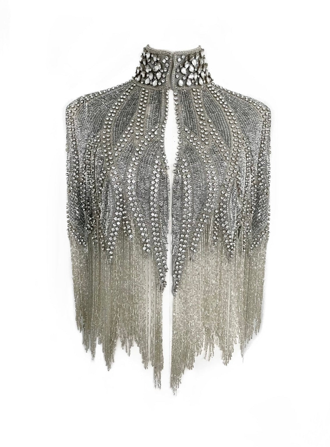 Silver cascade cape by L'Jai Amor displayed with flowing fabric and elegant drape, perfect for stylish layered looks.