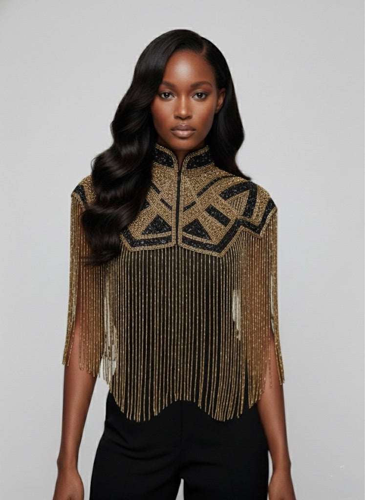 L'Jai Amor Axis Line Cape in elegant fabric, showcasing a flowing design with detailed stitching and stylish drape.