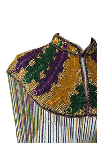 L'Jai Amor Big Chief Plume Cape with colorful feathers and intricate beadwork, displayed on a mannequin.