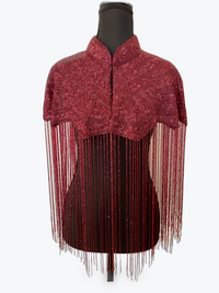L'Jai Amor Bordeaux Fringe Cape with elegant fringe detailing, draped over a mannequin showcasing stylish outerwear.