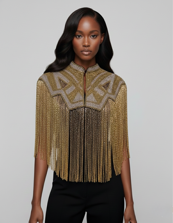 L'Jai Amor Golden Line Cape featuring luxurious gold fabric with intricate detailing and elegant draping.