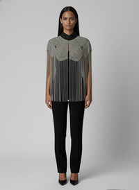 L'Jai Amor Liquid Steel Cape draped over a mannequin, showcasing its sleek, metallic finish and stylish design.