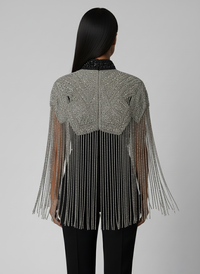 L'Jai Amor Liquid Steel Cape shown draped, featuring a sleek, metallic design perfect for stylish wear or costume accessories.