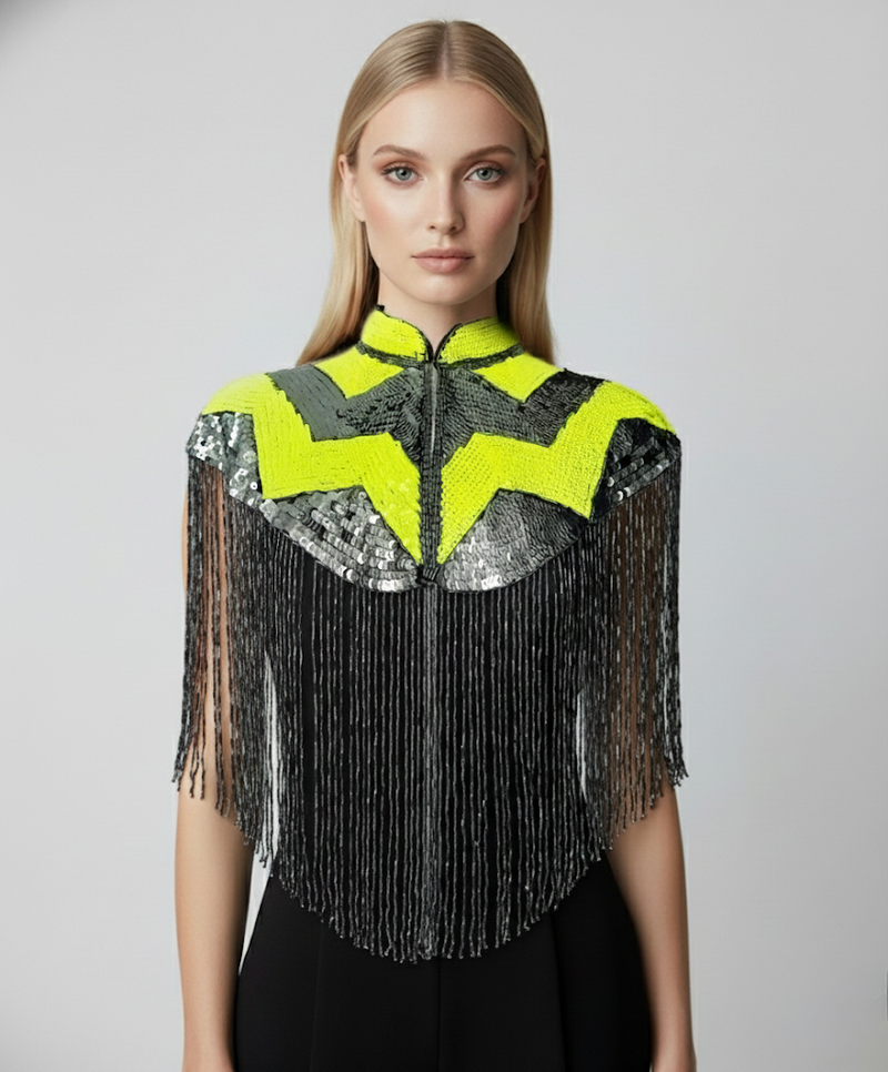 L'Jai Amor Pulse Sequin Cape draped over a mannequin, featuring shimmering sequins and a stylish, flowing design.