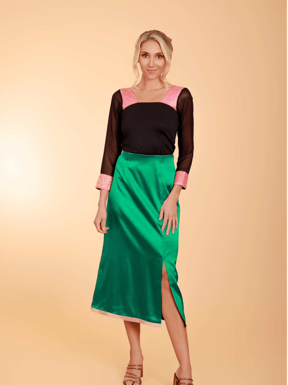 Black top paired with a green skirt from La' Agra's The Belle Skirt bottoms collection.