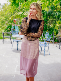 Purple La' Agra The Calia Skirt, stylish bottoms with a fitted design, shown on a model in the image.