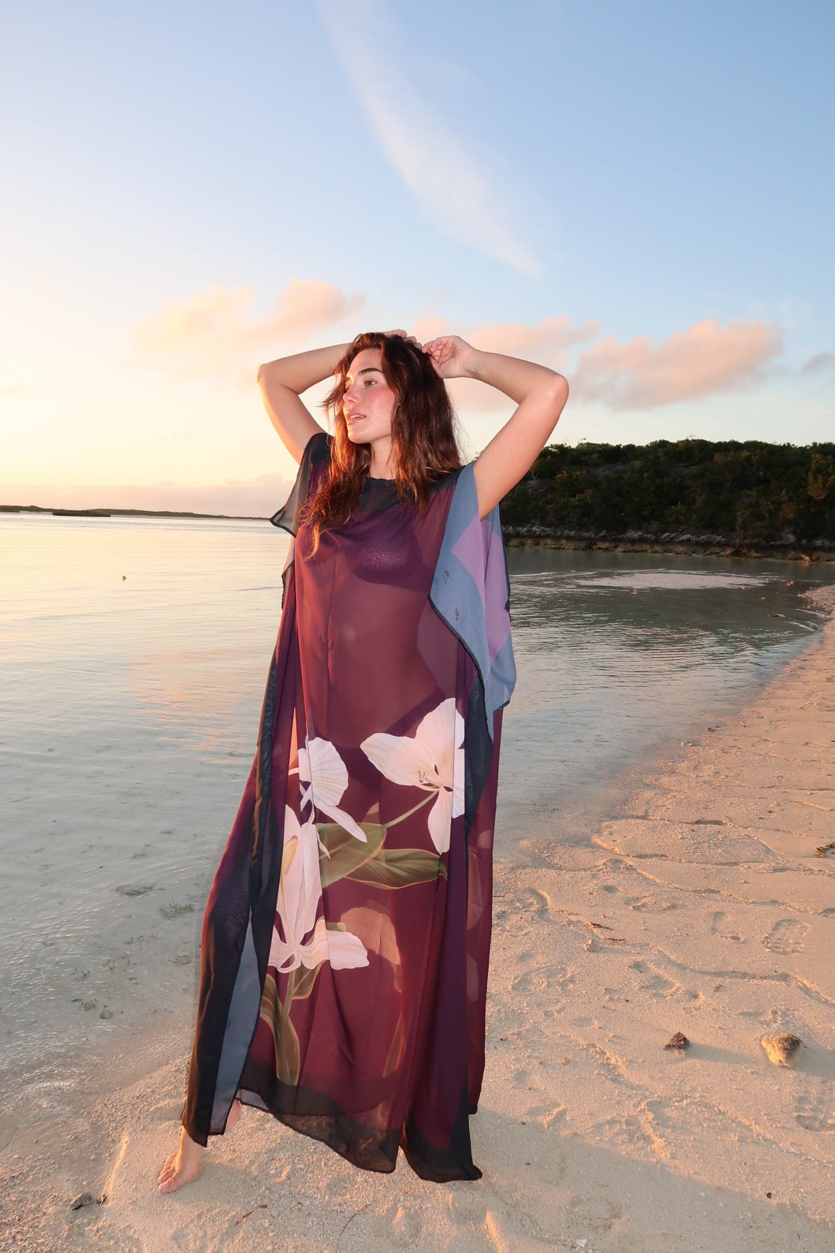 Magenta Blossom Kimono dress by LA'AVANA with floral pattern, flowing fabric, and wide sleeves, displayed on a hanger against a neutral background.