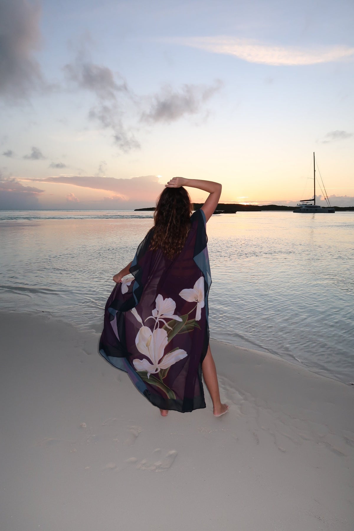 Magenta Blossom Kimono dress by LA'AVANA featuring floral pattern and flowing fabric, displayed on a hanger against a neutral background.