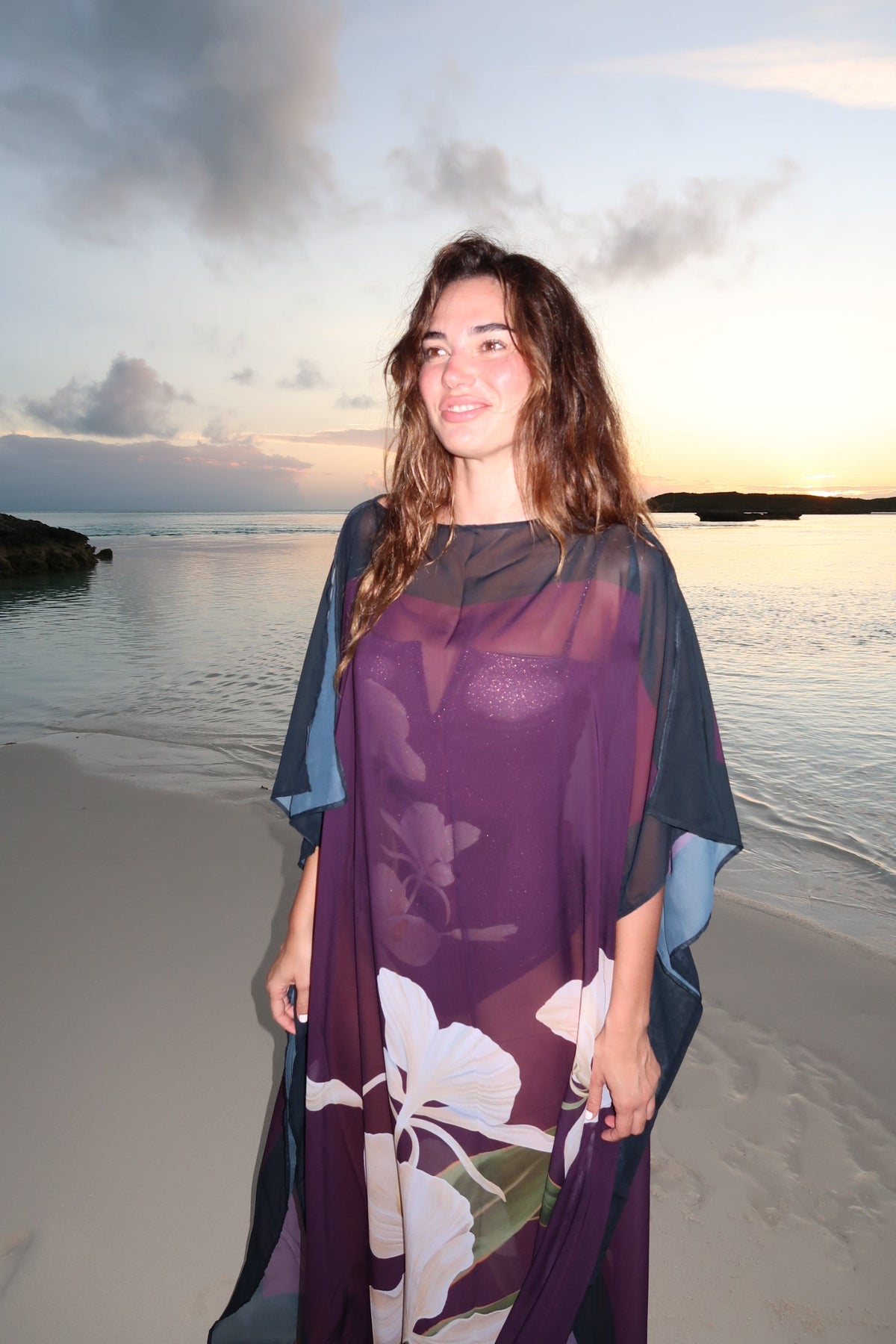 Magenta Blossom Kimono dress by LA'AVANA featuring floral patterns and flowing fabric, displayed on a hanger.