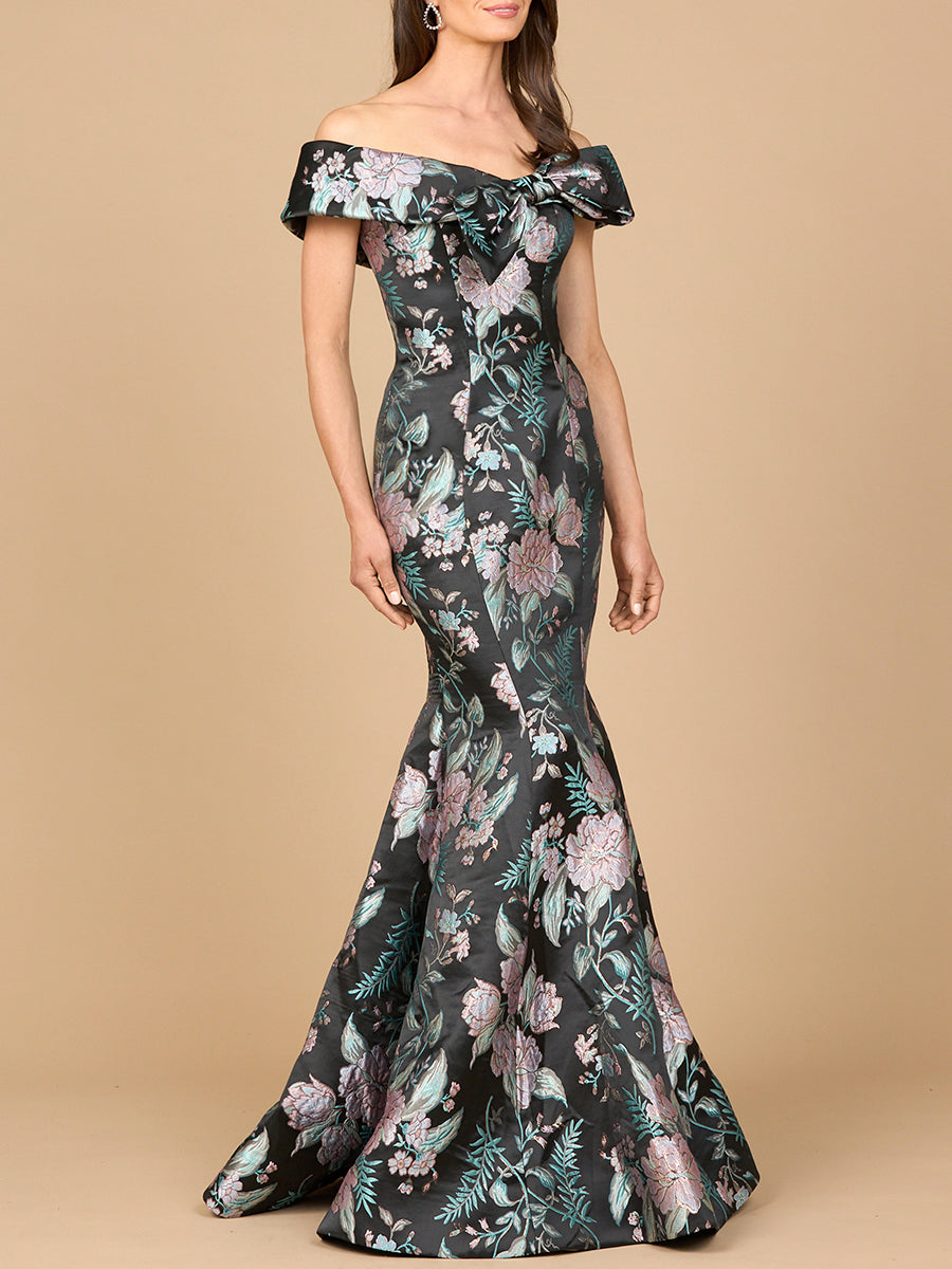 Black multi-colored fitted mermaid brocade gown by Lara New York, showcasing intricate fabric and elegant silhouette.