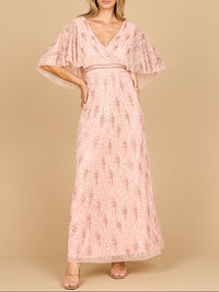 Emerald green beaded gown with half cape by Lara New York, elegant dress with intricate beadwork and flowing cape detail.