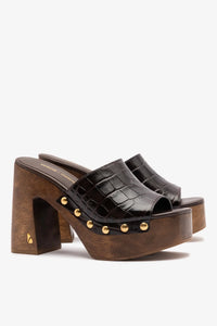 Dark oak croco leather mule by Larroude in collaboration with Kenneth Cole, featuring a sleek slip-on design and textured crocodile pattern.