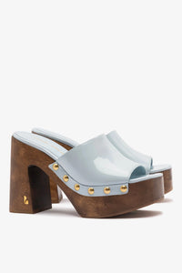 Larroudé x Kenneth Cole Mule Maya in glossy patent leather, stylish slip-on footwear with a sleek design and pointed toe.