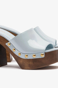 Larroude x Kenneth Cole Mule Maya in shiny patent leather, stylish slip-on footwear with a sleek design and pointed toe.