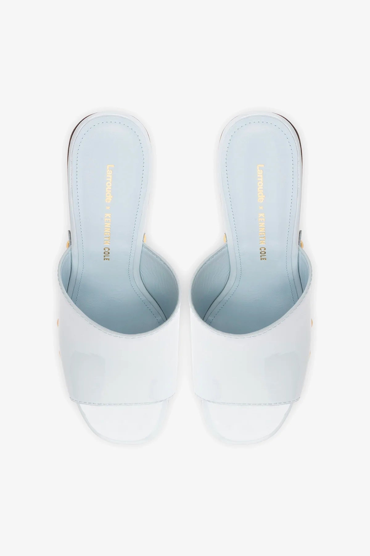 Larroudé x Kenneth Cole Mule Maya in glossy patent leather, stylish slip-on shoe with a sleek design and pointed toe.