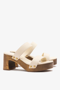 Larroude x Kenneth Cole ivory leather sandal with strappy design and low heel, perfect for casual and dressy summer wear.