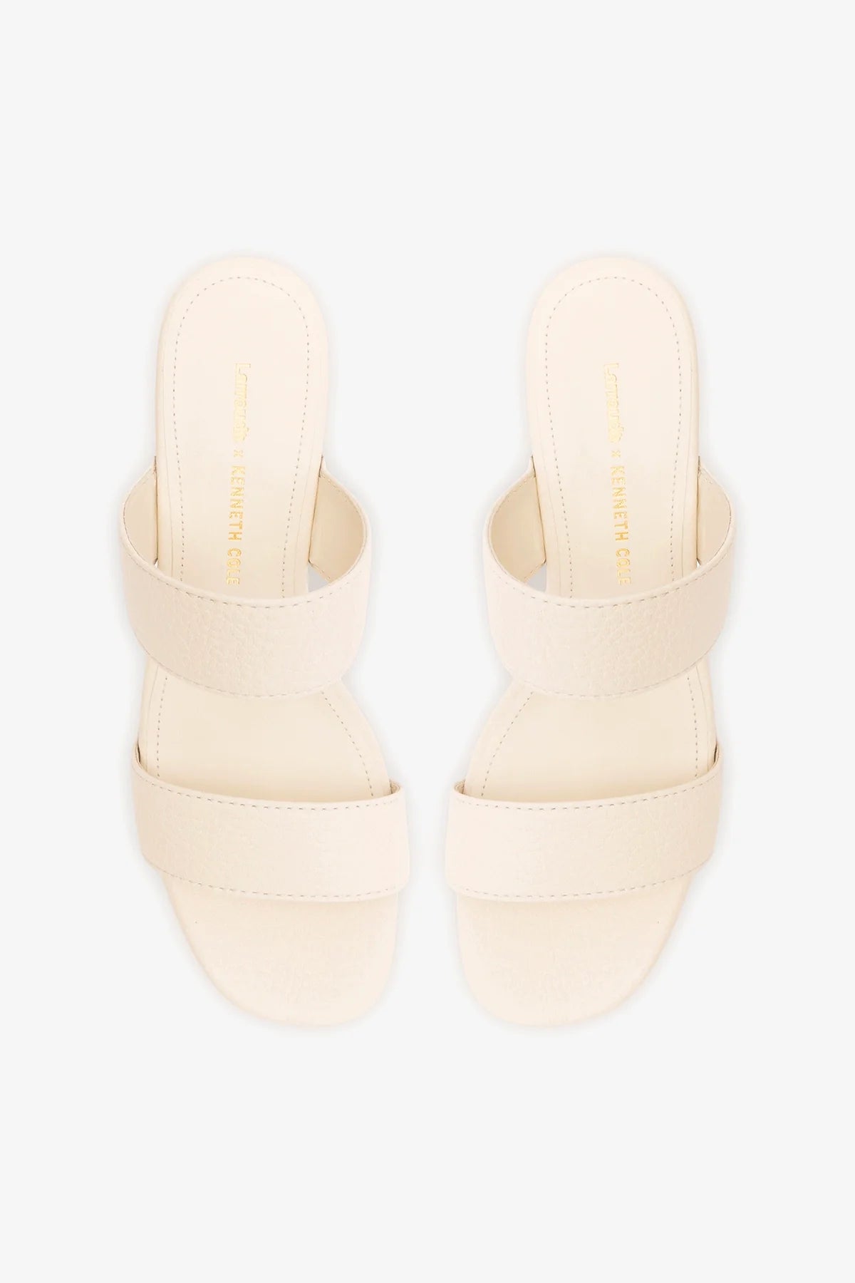 Larroudé x Kenneth Cole ivory leather sandal with open toe and strap design, featuring a stylish and elegant look.