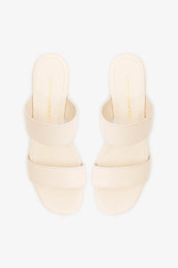 Larroudé x Kenneth Cole ivory leather sandal with open toe and strap design, featuring a stylish and elegant look.