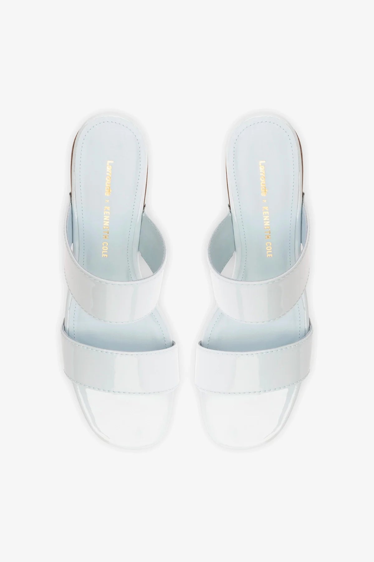 Larroude x Kenneth Cole Sandal Maya in glossy patent leather with sleek straps and a modern design.