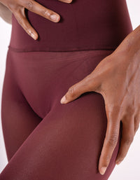 Les Belles Co semi-bordeaux hosiery showcasing sheer, elegant tights with a semi-opaque finish and smooth texture.